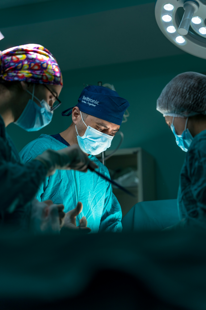 doctors performing surgery in an operating room