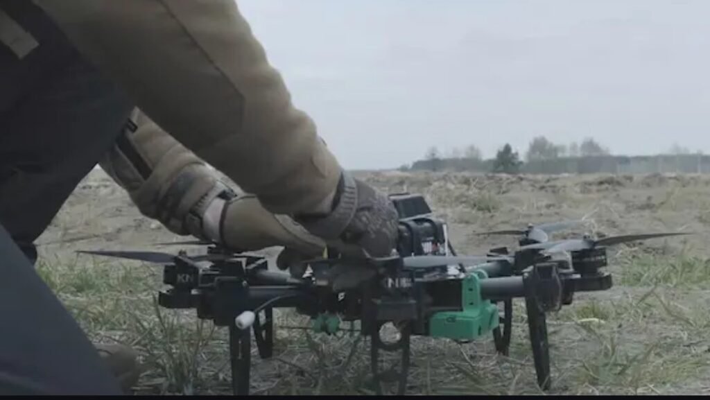 a specialist operating a drone using swarmer drone technology